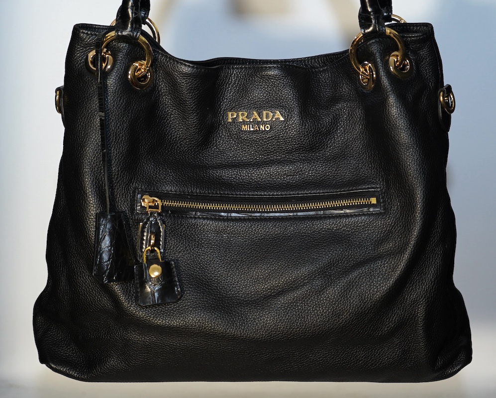 A black leather Prada handbag